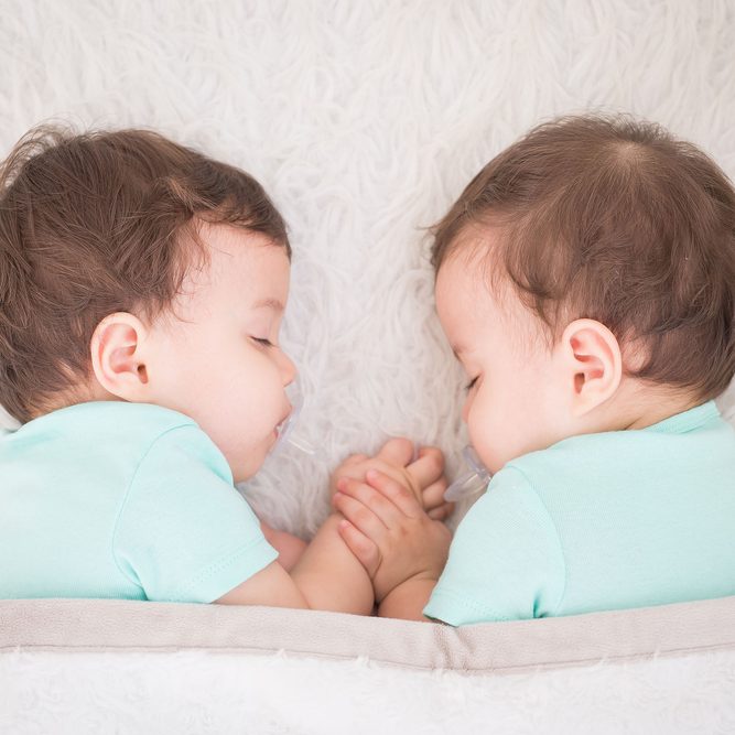 Newborn,Beautiful,Baby,Twins,Sleeping,With,Pacifier.,Closeup,Portrait,,Caucasian